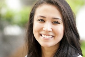 Closeup of a smiling young girl looking at camera