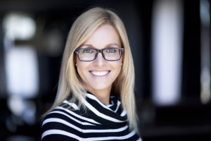 Blond Confident Woman Working At Home. With Glasses.